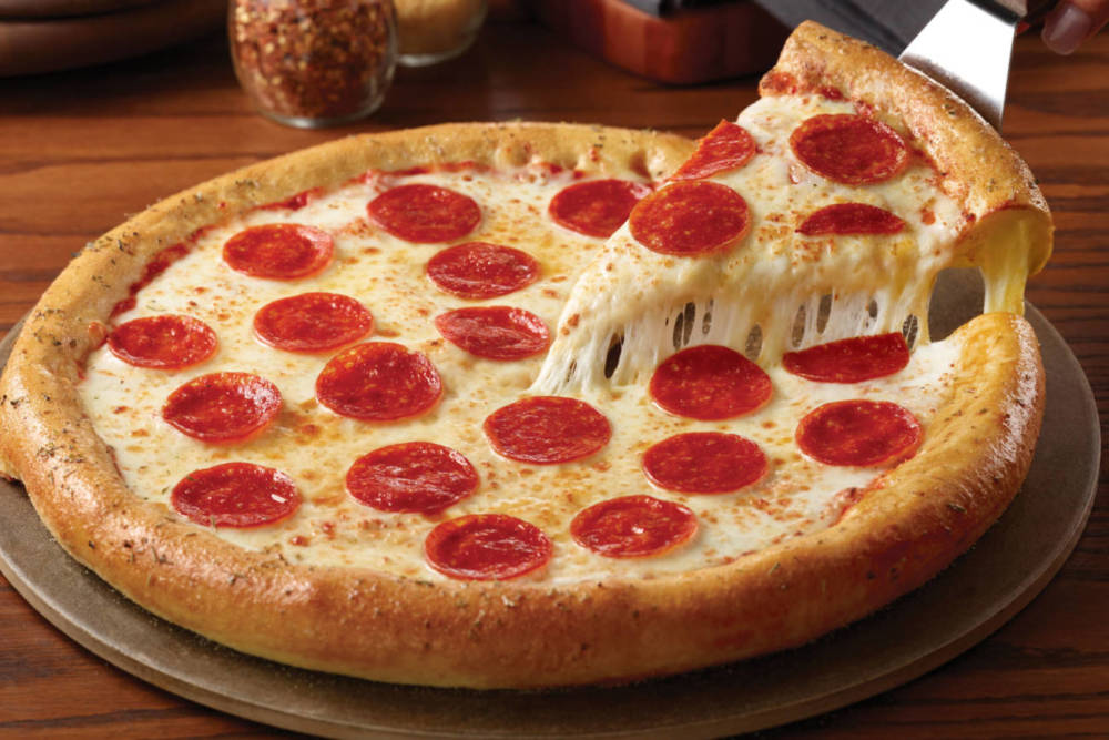 large and cheesy pepperoni pizza