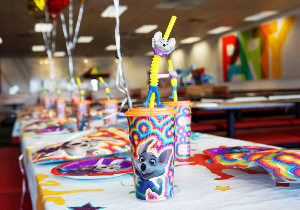 Birthday party table with decorations and cups