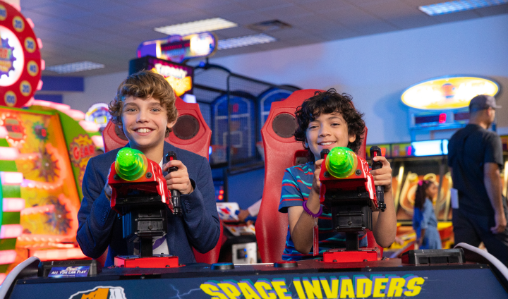 Boys playing space invaders