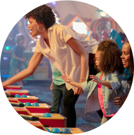 mom and child playing alley bowling game together