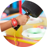 rechargeable band shown with hand holding arcade game hammer