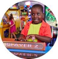 young child playing puzzle arcade game