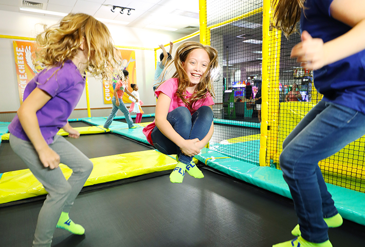 Kids jumping in the trampoline zone