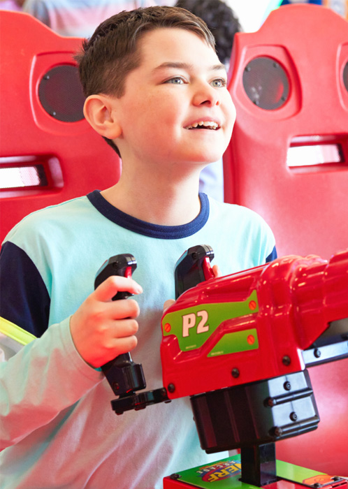 Boy playing a shooting game