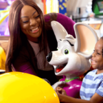 Mother and son on ride at Chuck E. cheese.