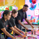 Chuck E. cheese cast members cleaning up after birthday party.