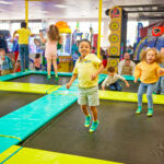 kids jumping on trampolines at chuck e. cheese