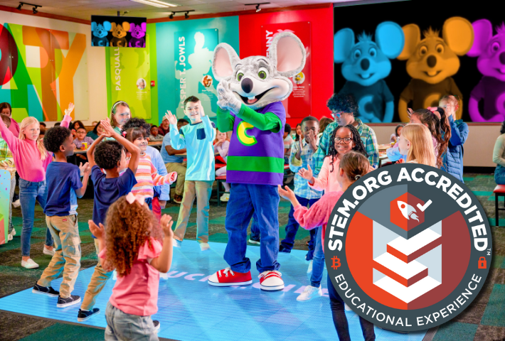 chuck e. cheese having a dance party with kids at chuck e. cheese