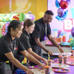 chuck e. cheese cast members cleaning up after birthday party