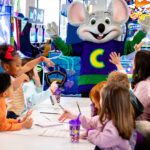 Children interacting with Chuck E. Cheese