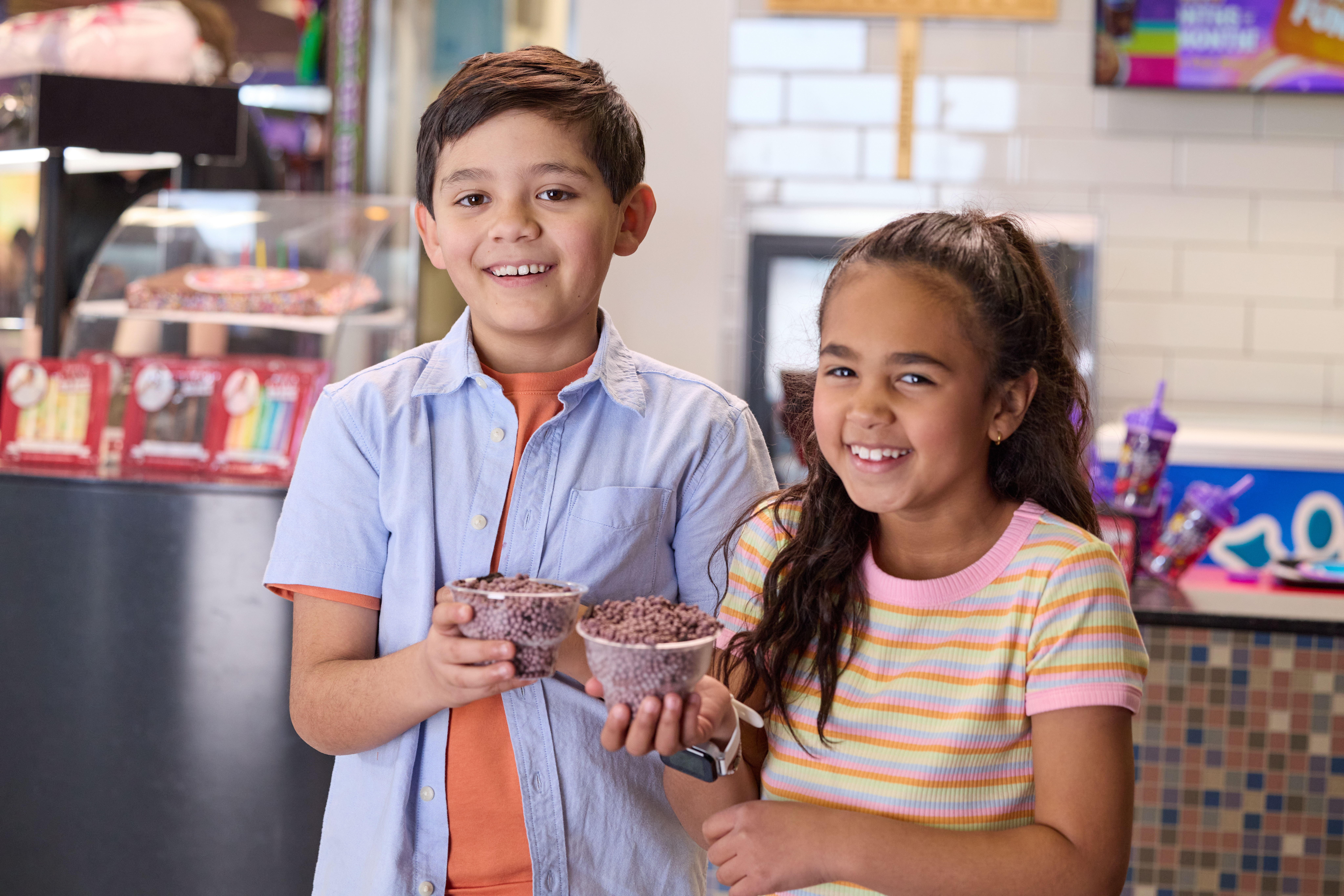 boy and girl holding cookie crunch ice cream
