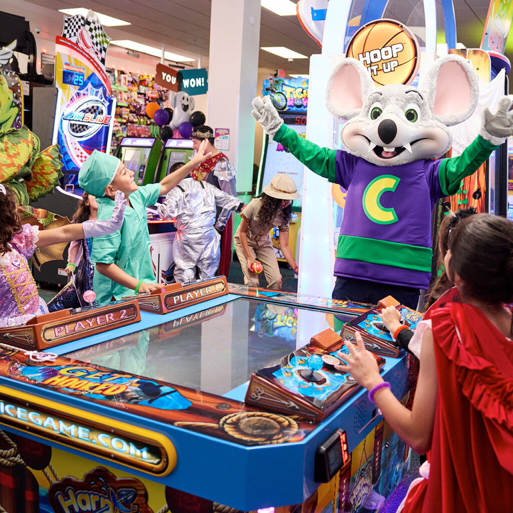 Children enjoying arcade games together.