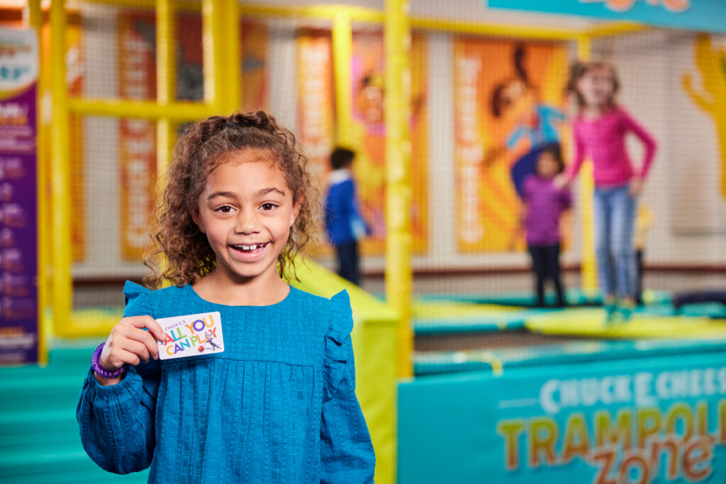 Young child bouncing on the Trampoline Zone at Chuck&nbsp;E.&nbsp;Cheese