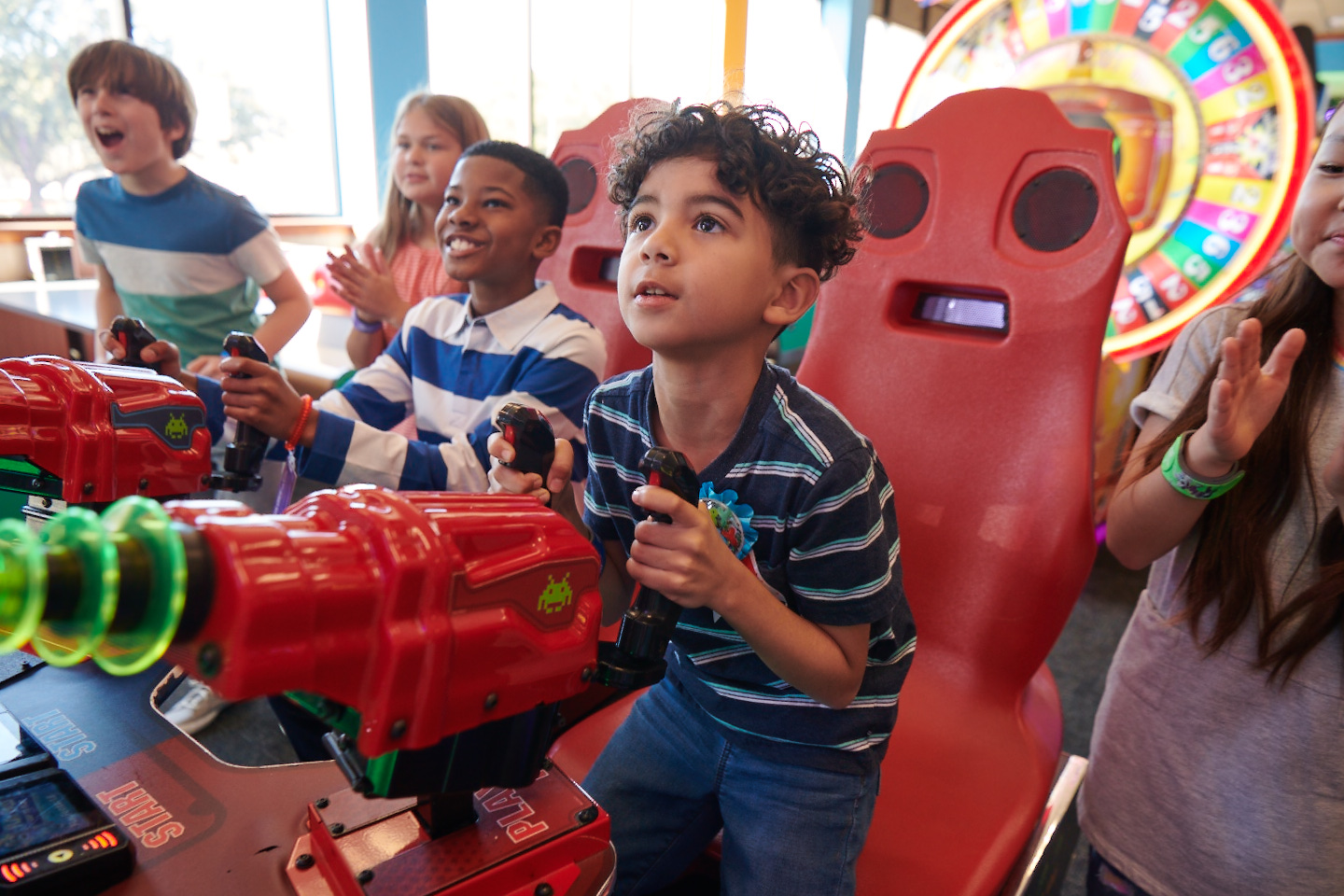 Children ages 5&ndash;10 playing arcade games at Chuck E. Cheese
