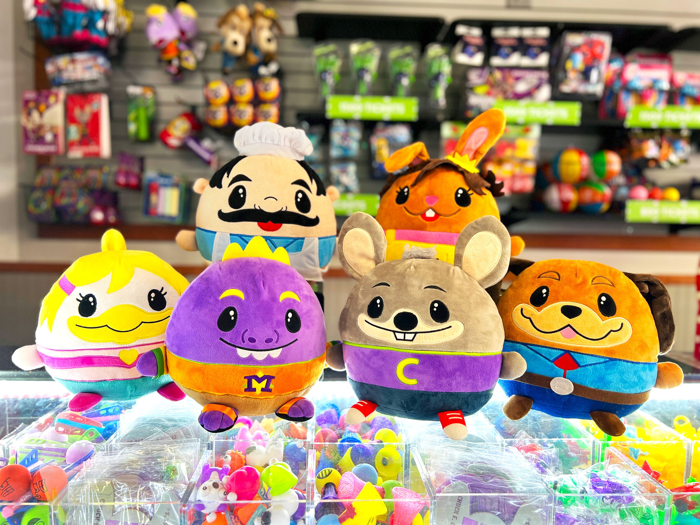 Plush toys and prizes at Chuck E. Cheese prize counter