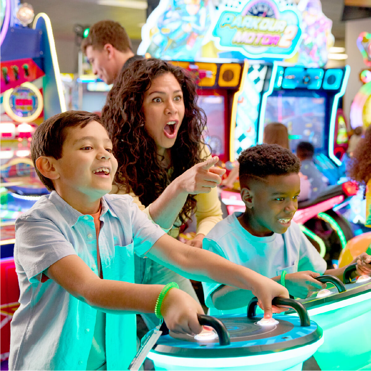 Kids racing arcade games at Chuck E. Cheese