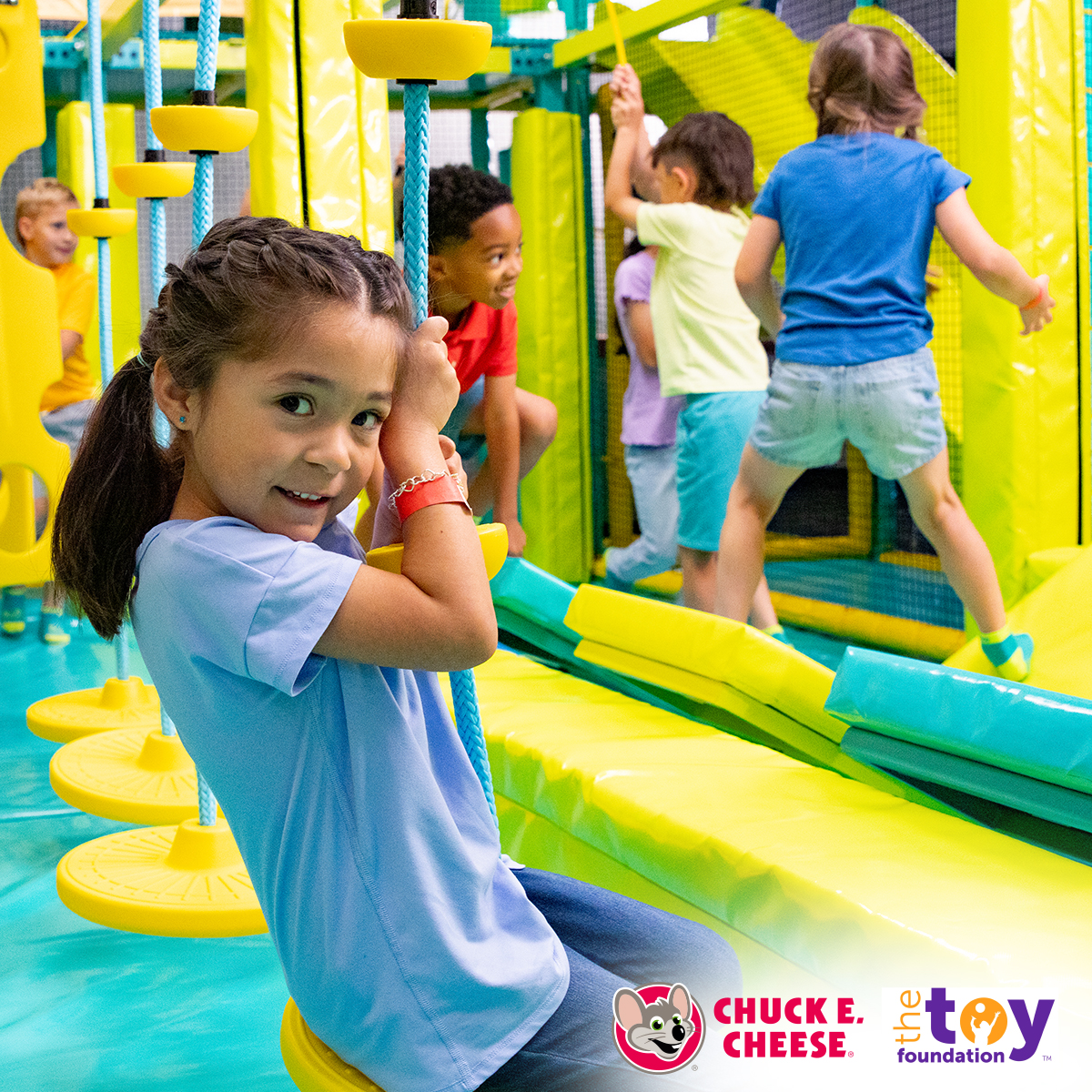 Chuck E. Cheese and The Toy Foundation™ fundraiser moment with kids at an in-store event.