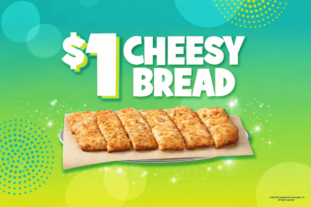 Chuck E. Cheese Cheesy Bread on a tray, advertised for $1, against a vibrant green and blue background.